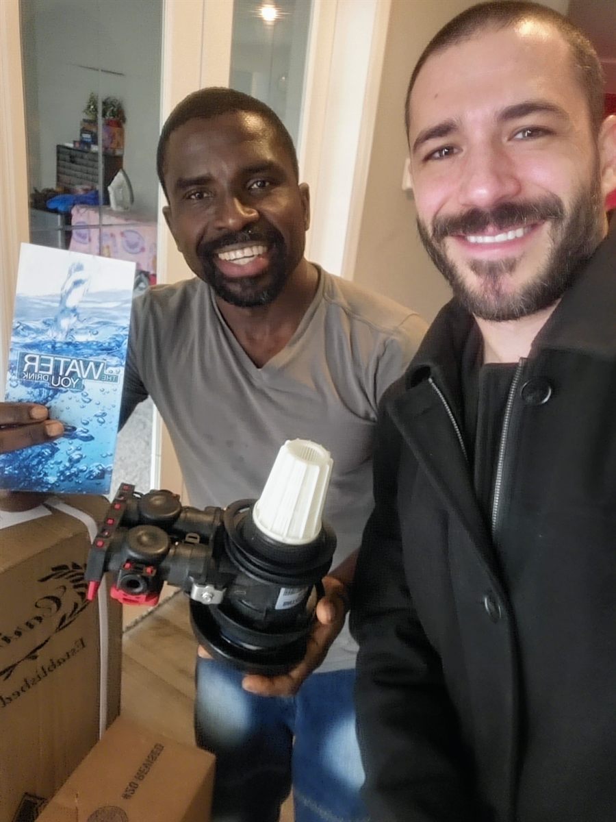 Pure Home Wellness customer reviewing water education booklet